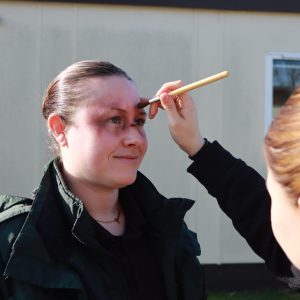 makeup artist applying moulage