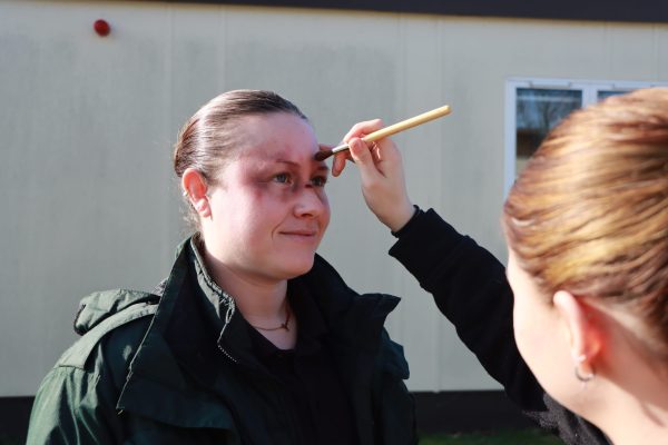 makeup artist applying moulage